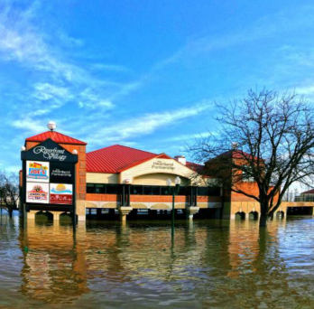 photo showing flooded mall parking lot 