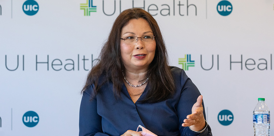 Senator Duckworth without her mask, speaking and gesturing