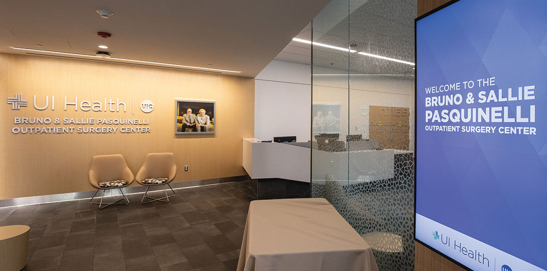 modern waiting area with digital sign reading The Bruno and Sallie Pasquinelli Outpatient Surgery Center