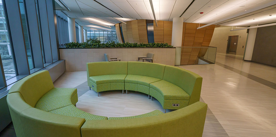 modern rounded seating on the upper level of the atrium