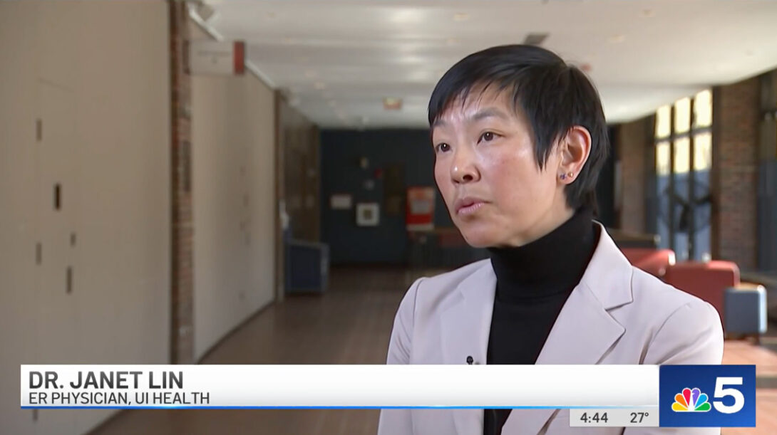 Dr. Janet Lin in a white lab coat, with short dark hair, appearing in a video interview