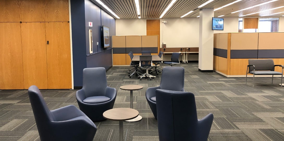 comfortable seating with tables in a large well-lit space