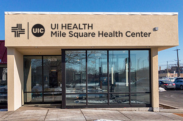 the Mile Square South Shore facility on a sunny day, showing the large UI health logo on the front of the buiding