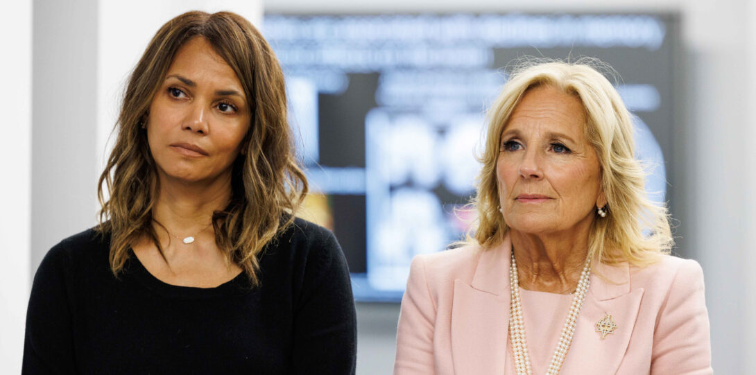 Halle Berry wearing dark clothing, and Dr. Jill Biden in a light pink suit, standing next to each other